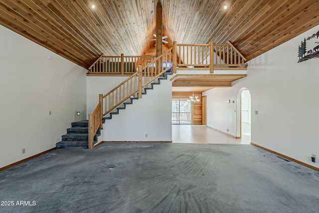 2793 Canyon Ridge Rd, Overgaard, AZ 85933 - unfurnished living room featuring stairs, baseboards, high vaulted ceiling, and a notable chandelier