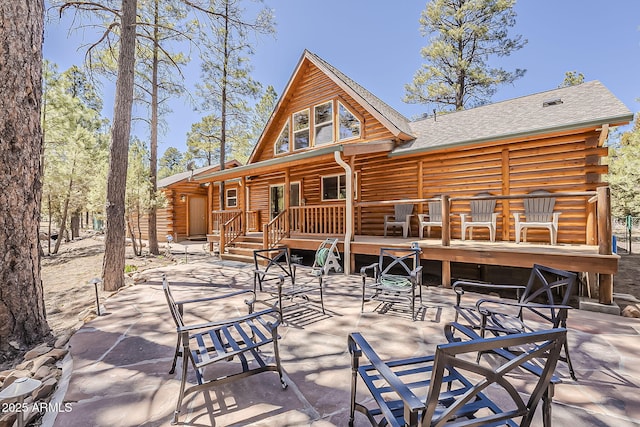 2793 Canyon Ridge Rd, Overgaard, AZ 85933 - back of house with a patio area, log exterior, and a deck