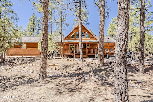 2793 Canyon Ridge Rd, Overgaard, AZ 85933 - view of front of house with faux log siding and covered porch