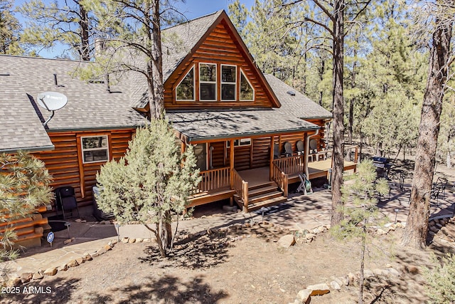 2793 Canyon Ridge Rd, Overgaard, AZ 85933 - back of house featuring a shingled roof and covered porch