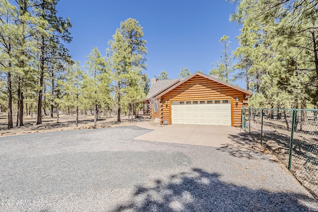 2793 Canyon Ridge Rd, Overgaard, AZ 85933 - view of home's exterior with gravel driveway, fence, and log siding