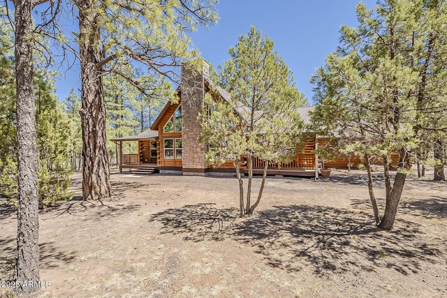 2793 Canyon Ridge Rd, Overgaard, AZ 85933 - rear view of property featuring a wooden deck