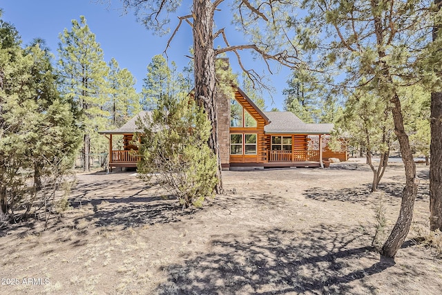 2793 Canyon Ridge Rd, Overgaard, AZ 85933 - rear view of house featuring a wooden deck, a shingled roof, and log siding