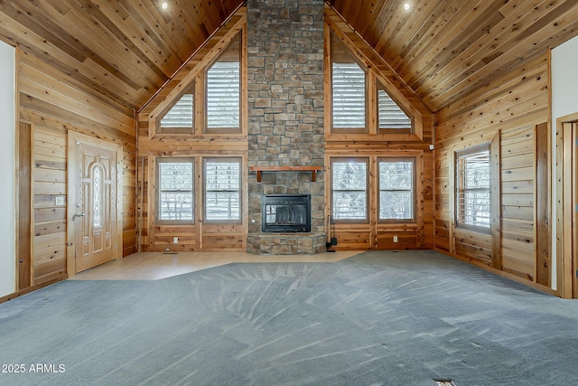 2793 Canyon Ridge Rd, Overgaard, AZ 85933 - unfurnished living room with high vaulted ceiling, wood ceiling, wooden walls, and a fireplace