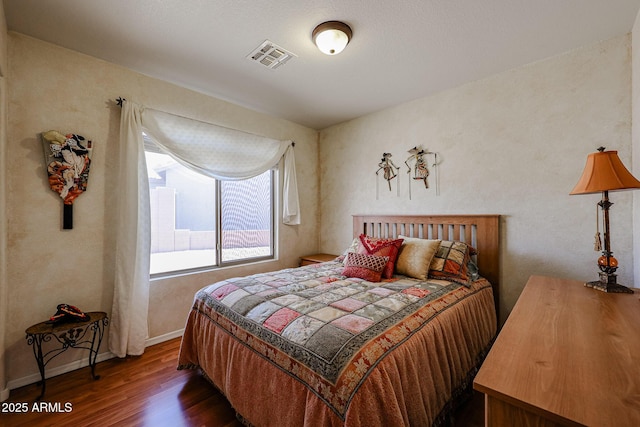 bedroom featuring dark hardwood / wood-style floors