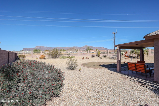 view of yard with a mountain view and a patio area