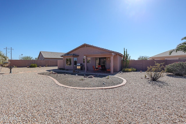 rear view of house with a patio area