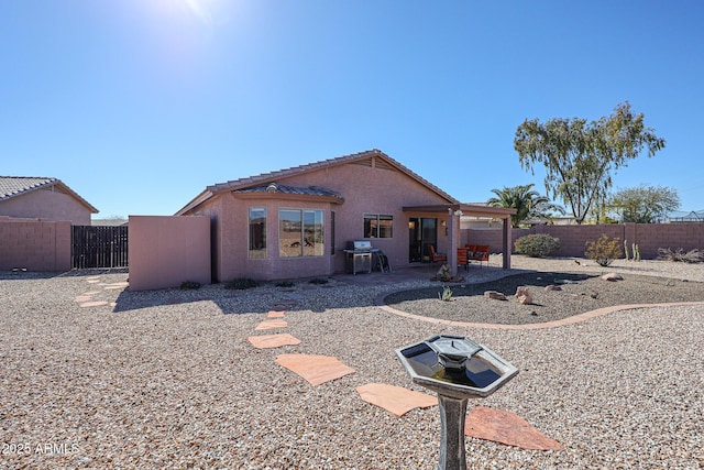 rear view of property with a patio area