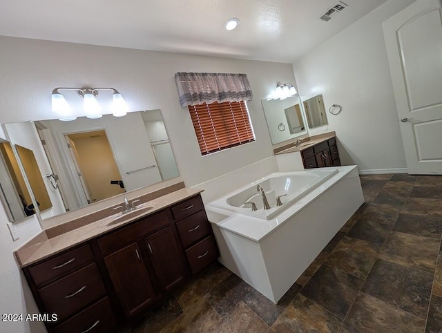 bathroom with vanity and a tub to relax in