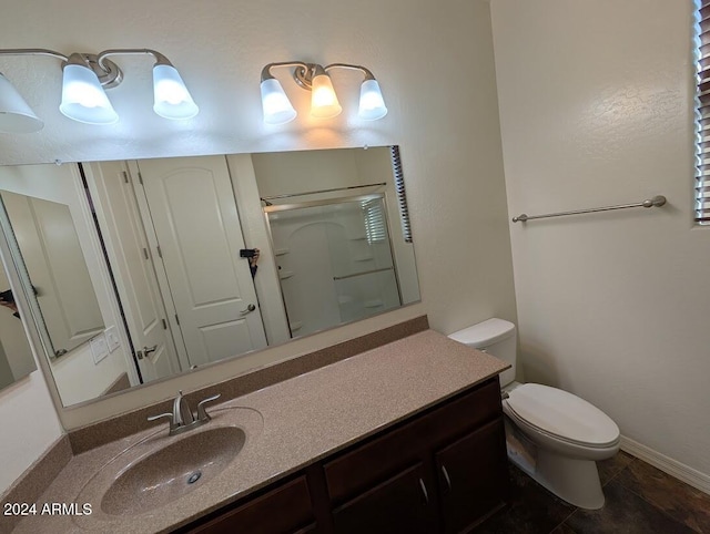 bathroom with walk in shower, tile patterned floors, vanity, and toilet