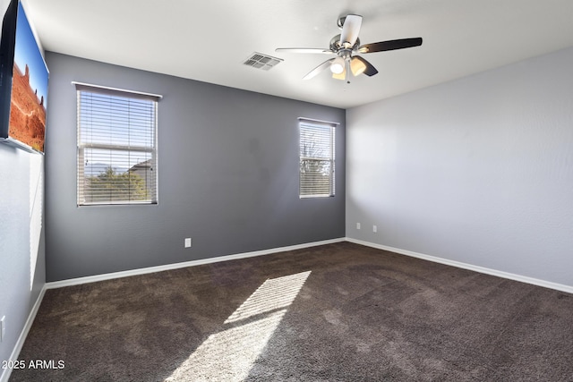 unfurnished room with carpet floors and ceiling fan