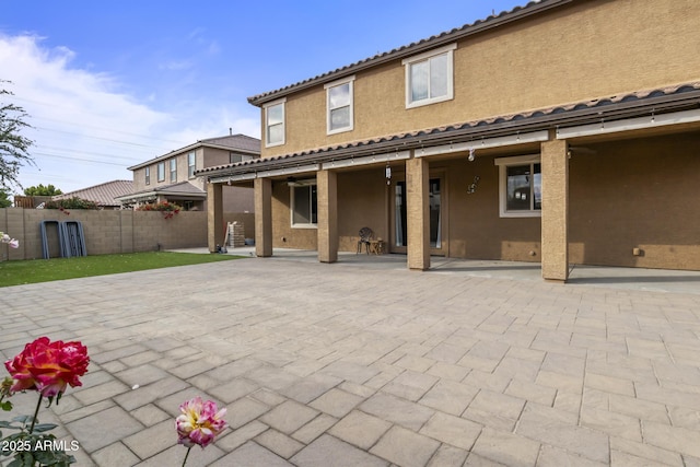 back of property featuring a patio