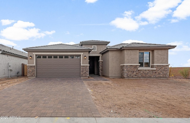 prairie-style home featuring a garage