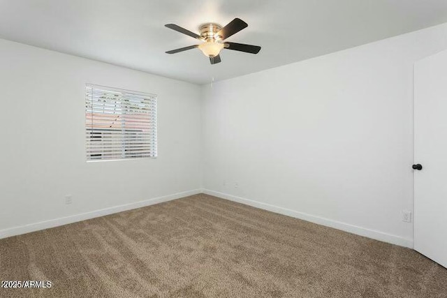 unfurnished room featuring carpet and ceiling fan