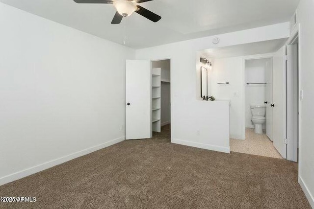 unfurnished bedroom featuring connected bathroom, ceiling fan, and light carpet