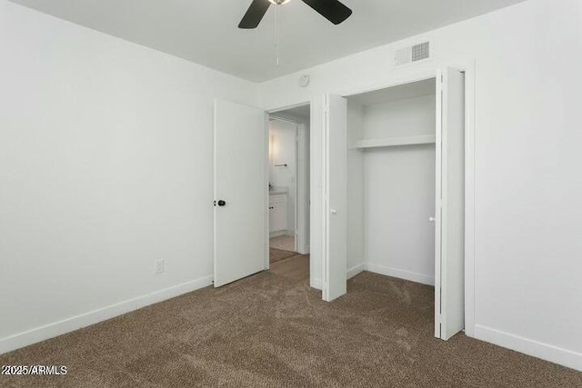 unfurnished bedroom with carpet, ceiling fan, and a closet