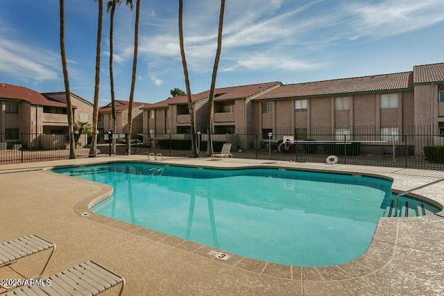 view of swimming pool with a patio