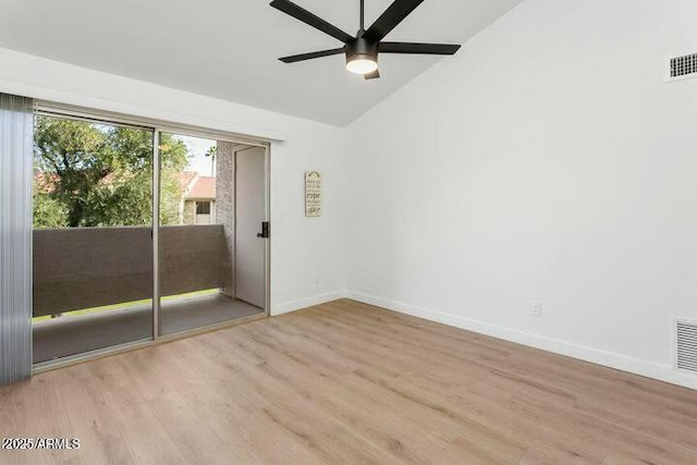 empty room featuring vaulted ceiling, light hardwood / wood-style flooring, and ceiling fan