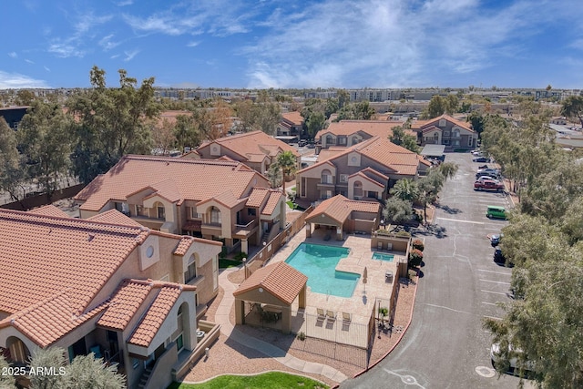 birds eye view of property with a residential view