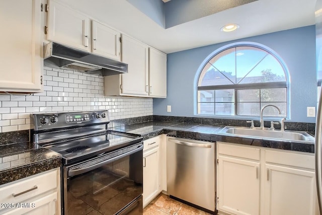 kitchen with tile countertops, under cabinet range hood, black range with electric stovetop, a sink, and dishwasher