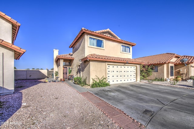 4545 N 67th Ave Unit 1101, Phoenix, AZ 85033 - view of front facade with stucco siding, concrete driveway, a tiled roof, a garage, and a chimney