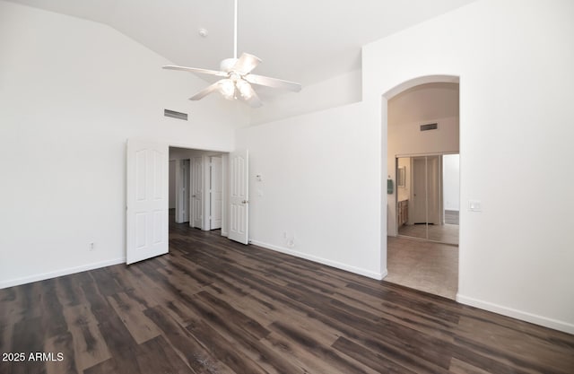 5153 W Topeka Dr, Glendale, AZ 85308 - empty room featuring arched walkways, dark wood-type flooring, visible vents, and ceiling fan