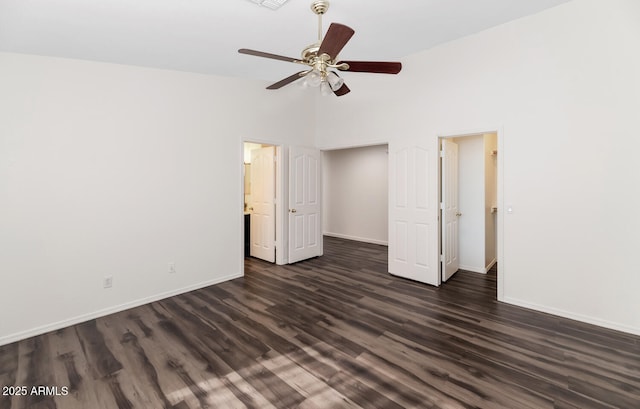 5153 W Topeka Dr, Glendale, AZ 85308 - unfurnished bedroom with high vaulted ceiling, dark wood-type flooring, baseboards, and ceiling fan