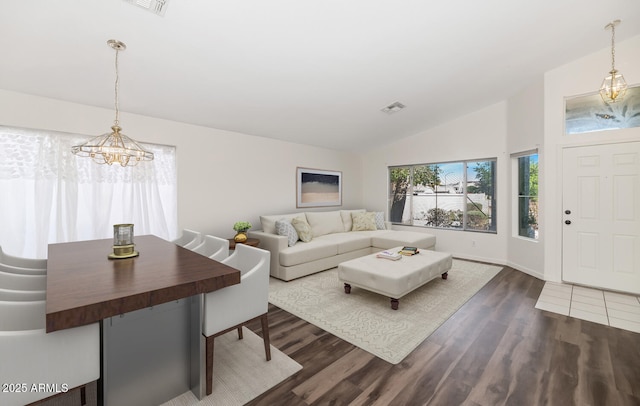 5153 W Topeka Dr, Glendale, AZ 85308 - living area featuring dark wood-style floors, visible vents, an inviting chandelier, and lofted ceiling