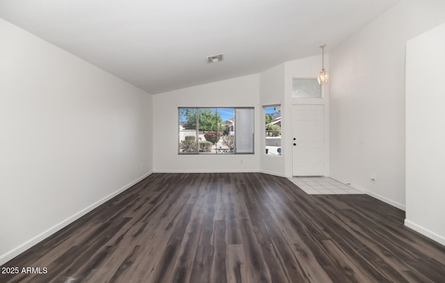 5153 W Topeka Dr, Glendale, AZ 85308 - unfurnished living room featuring high vaulted ceiling, baseboards, dark wood finished floors, and visible vents