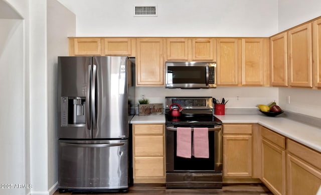 5153 W Topeka Dr, Glendale, AZ 85308 - kitchen featuring visible vents, light countertops, appliances with stainless steel finishes, and light brown cabinetry