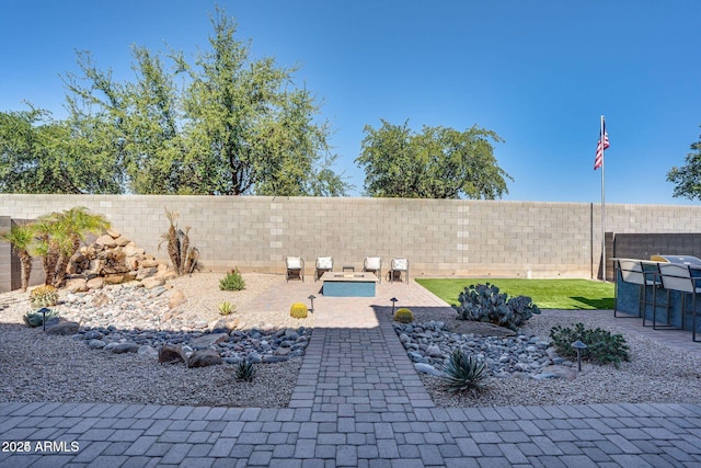 view of yard featuring a patio area and a fenced backyard