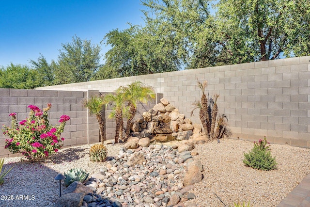 exterior details featuring a fenced backyard