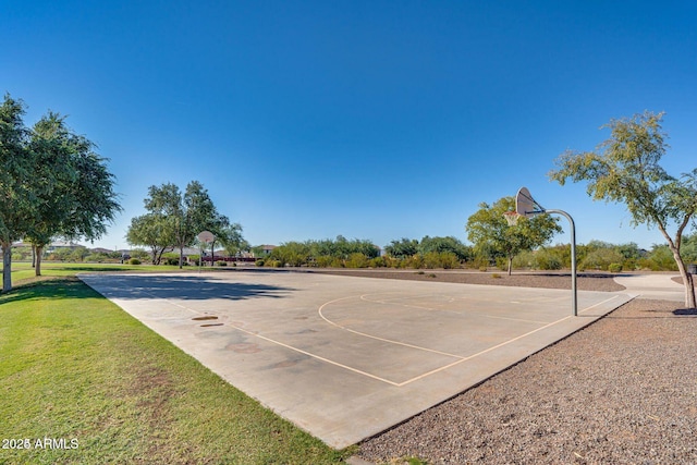 view of basketball court with community basketball court and a yard