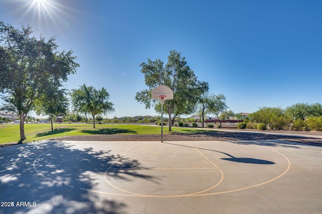 view of basketball court featuring community basketball court and a lawn