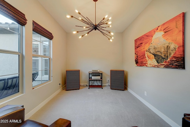 living area featuring a notable chandelier and carpet floors