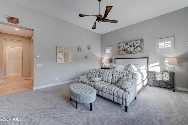 carpeted bedroom with ceiling fan and multiple windows