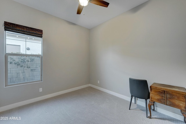 carpeted office featuring ceiling fan