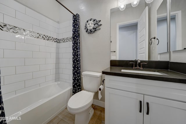 full bathroom featuring shower / tub combo with curtain, vanity, and toilet