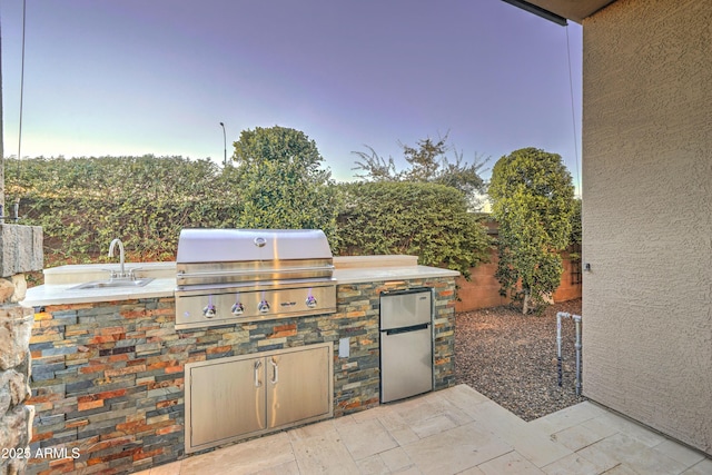 view of patio / terrace featuring area for grilling, sink, and grilling area