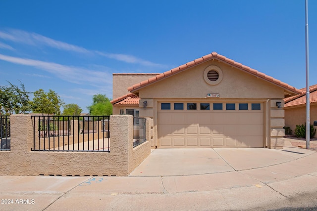 mediterranean / spanish-style house featuring a garage