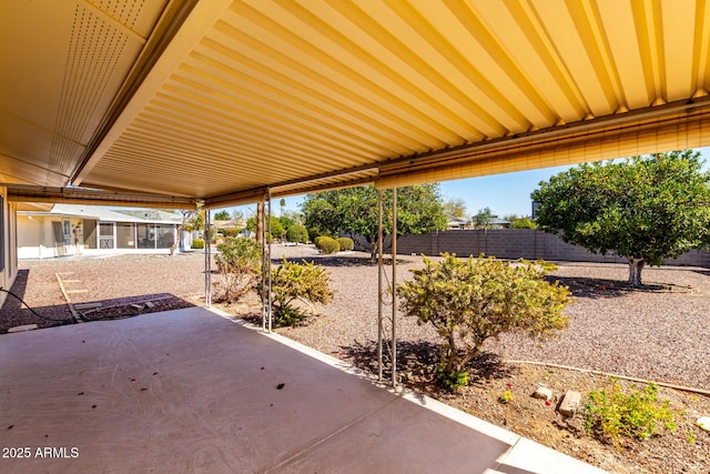 view of patio featuring fence