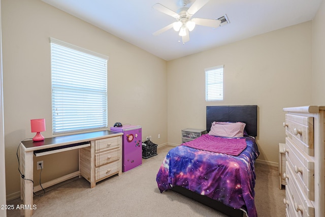 bedroom with ceiling fan and light colored carpet