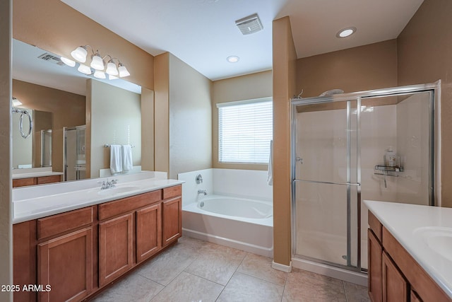 bathroom with tile patterned floors, vanity, and independent shower and bath