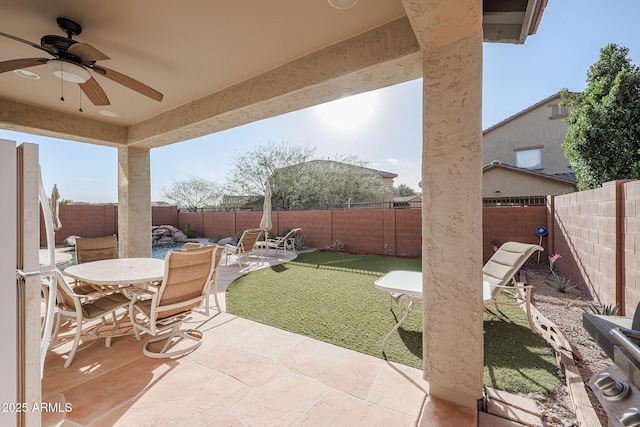 view of patio / terrace featuring ceiling fan