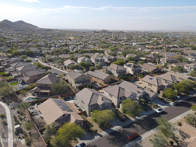 birds eye view of property with a mountain view