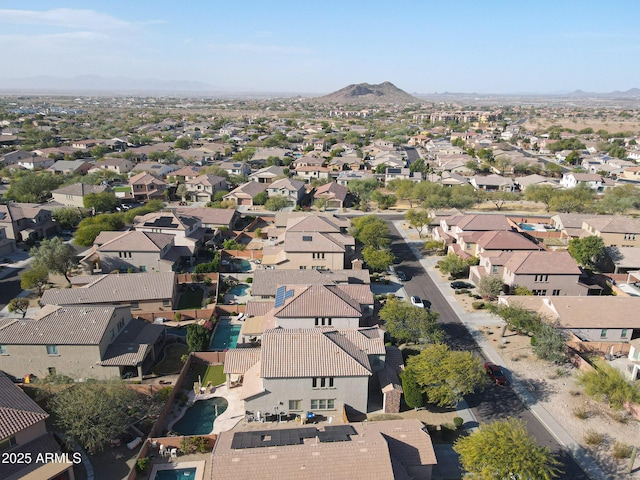 birds eye view of property with a mountain view