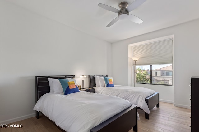 bedroom featuring ceiling fan and hardwood / wood-style flooring