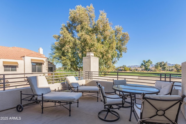 view of patio with a balcony