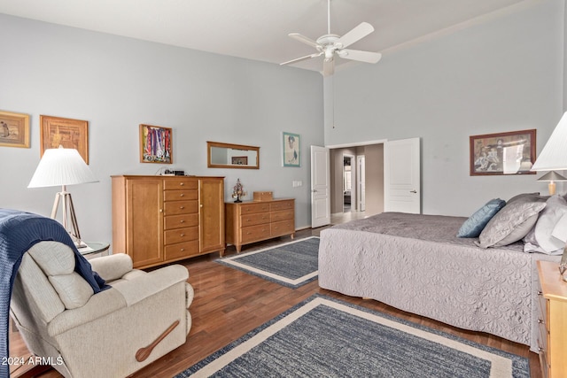 bedroom featuring ceiling fan and dark wood-type flooring