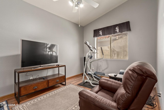 workout area with light hardwood / wood-style floors, ceiling fan, and lofted ceiling